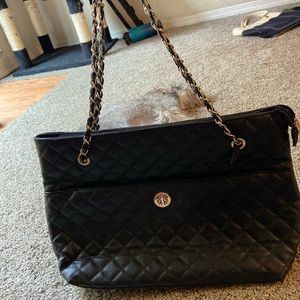 Black shoulder bag with gold detailing